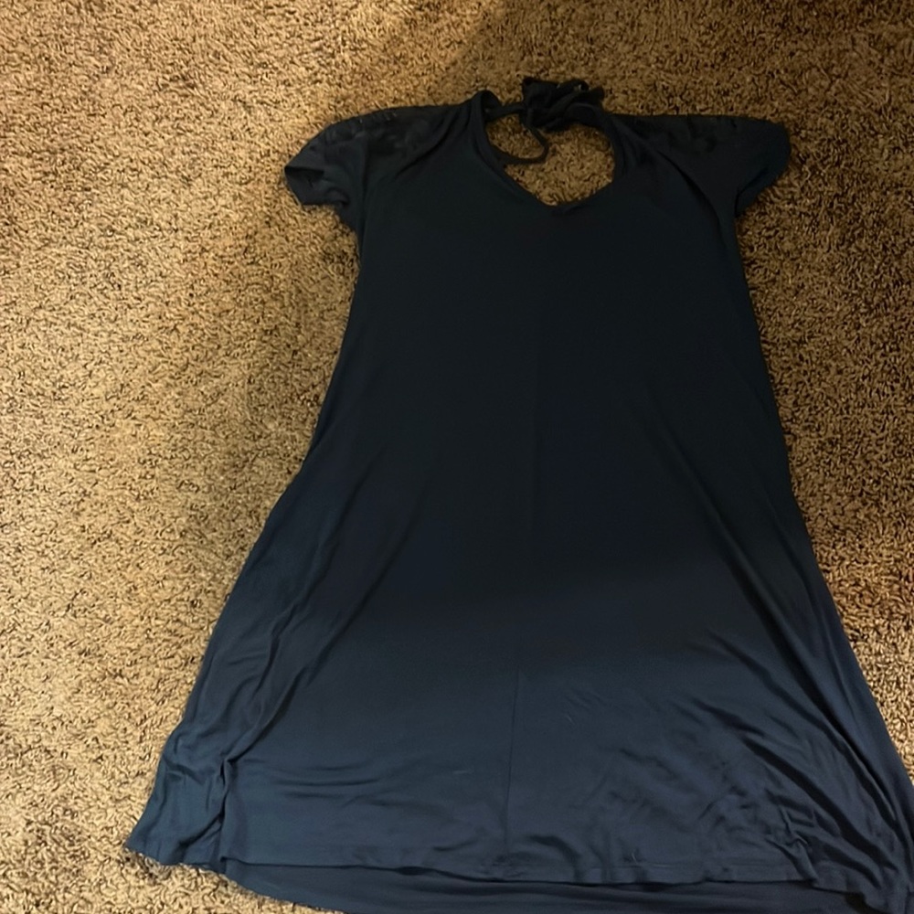 Blue dress with pretty flower designs on the shoulder with a small open back.